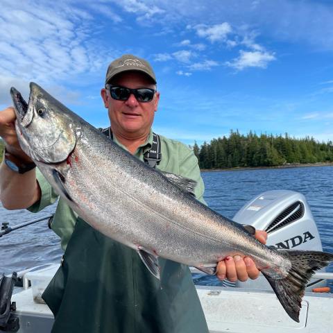 a person holding a fish
